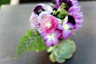 Purple flowers purple centrepiece 8 Wedding Planning Advice Finding A Florist