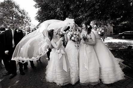 Wind catching bride's veil blustery veil Planning For Autumn Weather